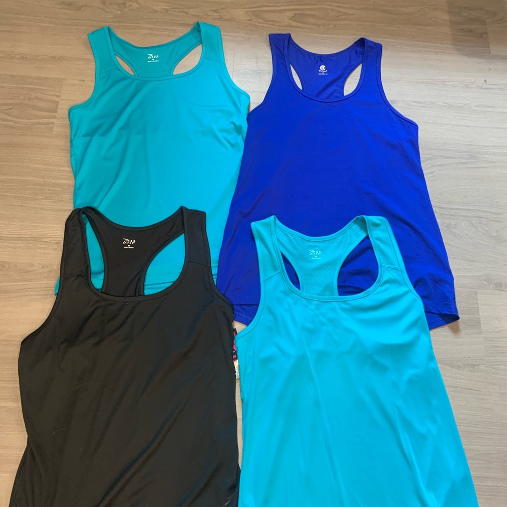 4 Size Medium DriFit style workout shirts!